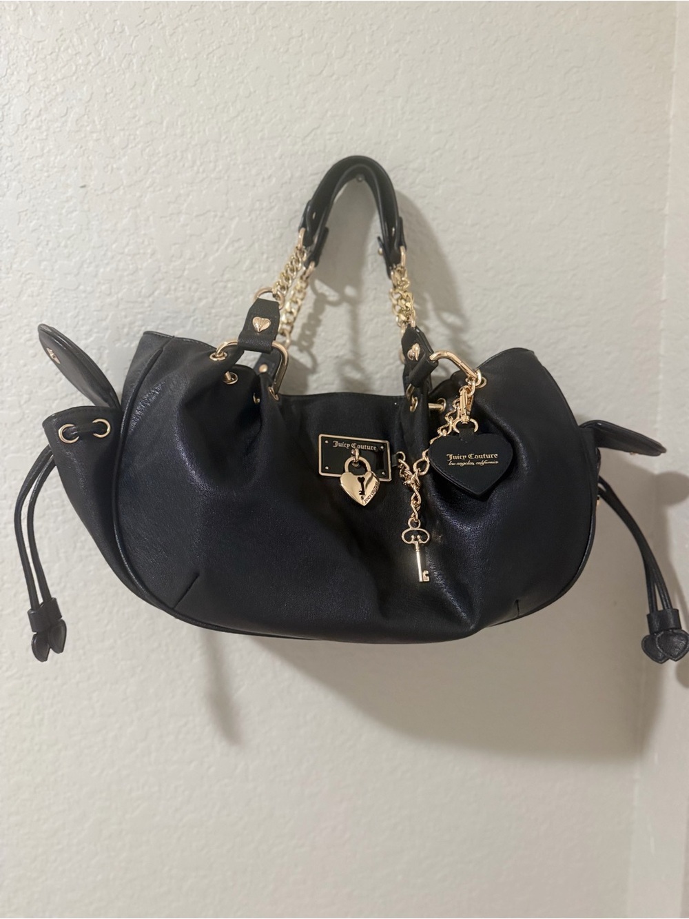Juicy Couture Black Drawstring Shoulder Bag with Gold Chain Accents